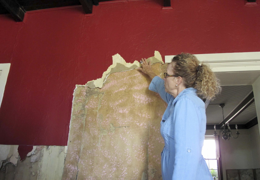 A historical restoration specialist, tours a flood-damaged historic home in St. Augustine, Fla. The home was flooded by 3-to-4-feet of water during Hurricane Matthew. While it&#039;s original coquina walls withstood the water damage, all of the more modern materials like drywall and plaster had to be removed. More than 1,000 historic homes and buildings in St. Augustine were damaged by storm surge, a University of Florida team has found. (AP Photo/ Jason H.