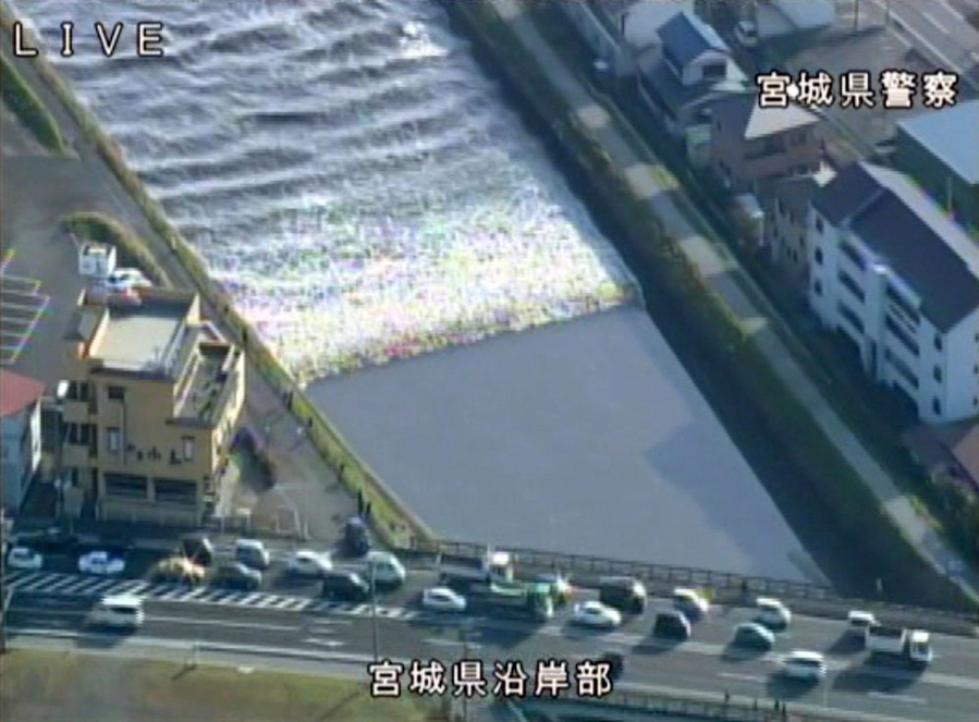 In this image made from video released by Miyagi Prefectural Police, the water flows up in the Sunaoshi River in Tagajo, Miyagi prefecture, northern Japan, as a tsunami warning is issued following a strong earthquake Tuesday, Nov. 22, 2016. A powerful earthquake off the northeast Japanese shore Tuesday sent residents fleeing to higher ground and prompted worries about the Fukushima nuclear power plant destroyed by a tsunami five year ago. The warning was lifted nearly four hours later.