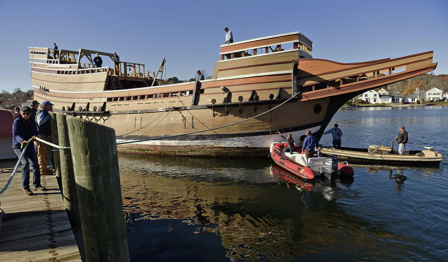 Workers at Mystic Seaport move the Mayflower II from the dock into the ship-lift to be hauled out of the Mystic River on Friday at the Henry B. duPont Preservation Shipyard in Stonington, Conn. (SEAN D.