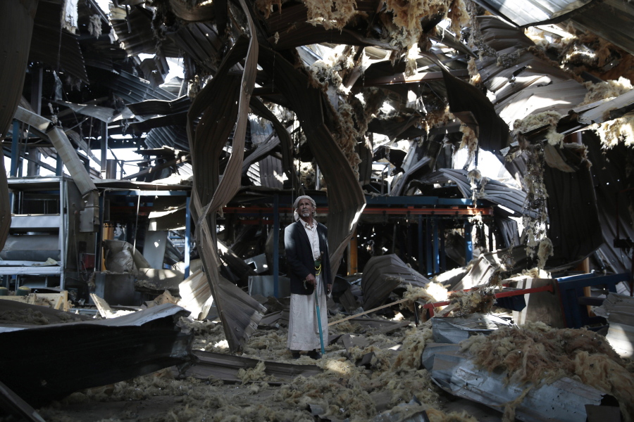 Massoud Abdullah Azzan, 75, who is a doorkeeper, stands amid the rubble of Alsonidar Group&#039;s water pumps and pipes factory after it was hit by Saudi-led airstrikes, in Sanaa, Yemen. In the air campaign by Saudi Arabia and its allies against Yemen???s Shiite rebels, rights experts say there has been a pattern by the Saudi-led coalition in depending on faulty intelligence, failing to distinguish between civilian and military targets and disregarding the likelihood of civilian casualties. Experts say some of the strikes likely amount to war crimes.