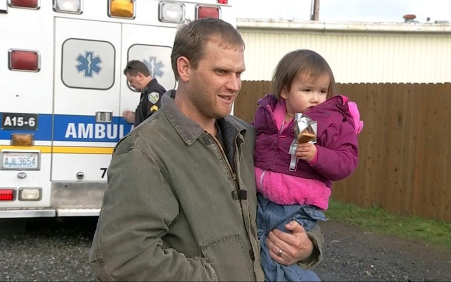 Jason McAlister holds his daughter at a store  Thursday in Matlock, after they were found safe -- along with McAlister&#039;s wife and another of their four children -- earlier Thursday in rural Mason County in Washington state. The couple and the two children were reported missing Tuesday, Nov. 15, 2016, after they went for a drive and failed to pick up their older children after school, authorities said.