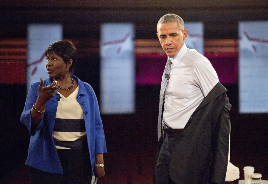 President Barack Obama removes his suit coat as he participates in a televised town hall event June 1 at Lerner Theatre in Elkhart, Ind., with PBS &quot;NewsHour&quot; co-anchor and manager editor Gwen Ifill, left. Ifill died on Monday of cancer, PBS said. She was 61.