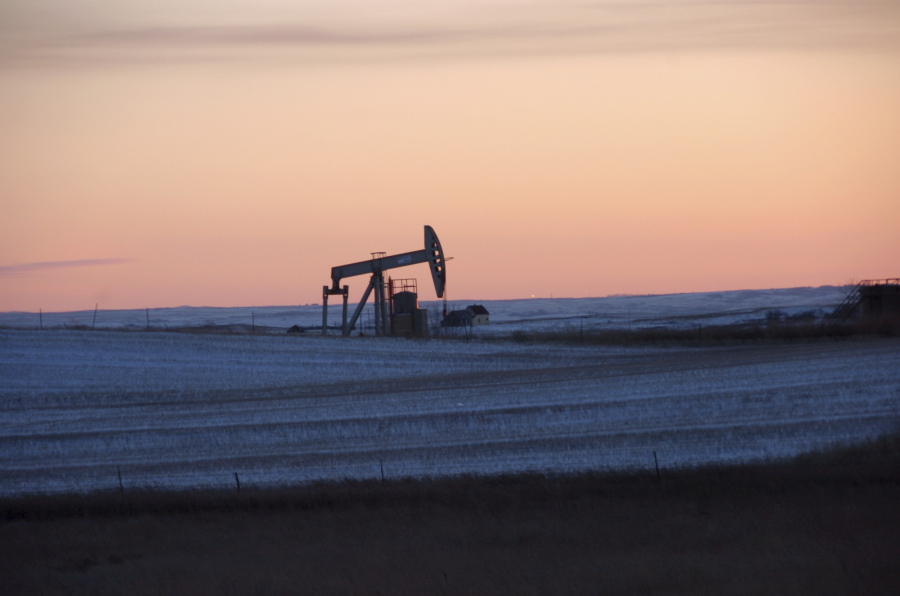 A pump jack pulls oil from the ground near New Town, N.D.