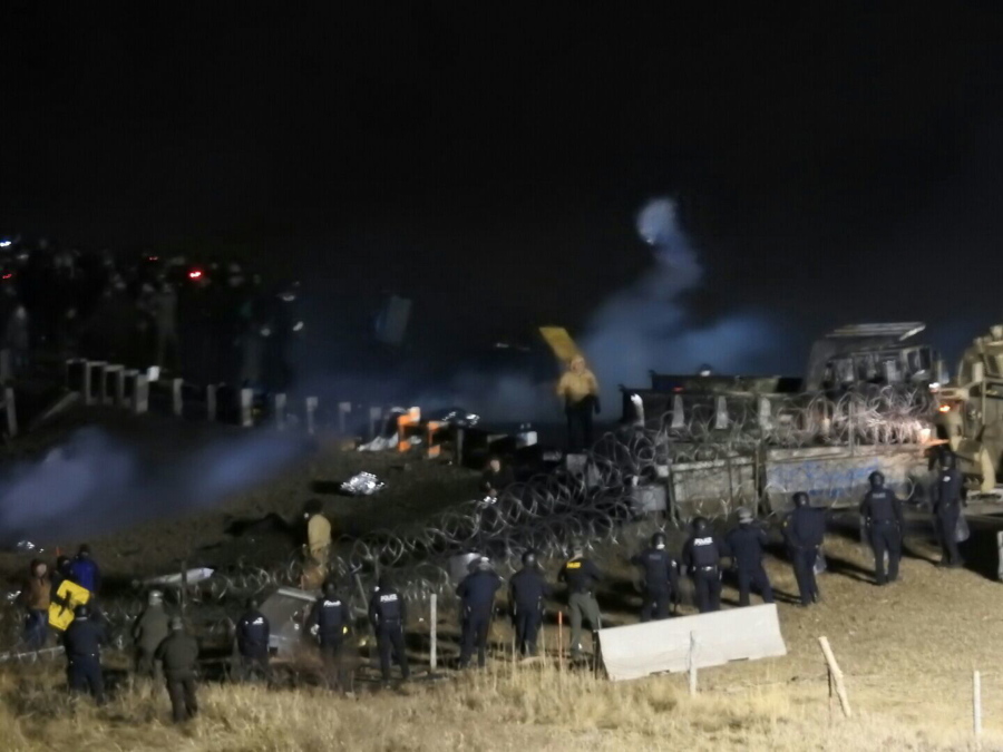 Law enforcement and protesters clash near the site of the Dakota Access pipeline on Sunday, Nov. 20, 2016, in Cannon Ball, N.D. The clash came as protesters sought to push past a bridge on a state highway that had been blockaded since late October, according to the Morton County Sheriff&#039;s Office.