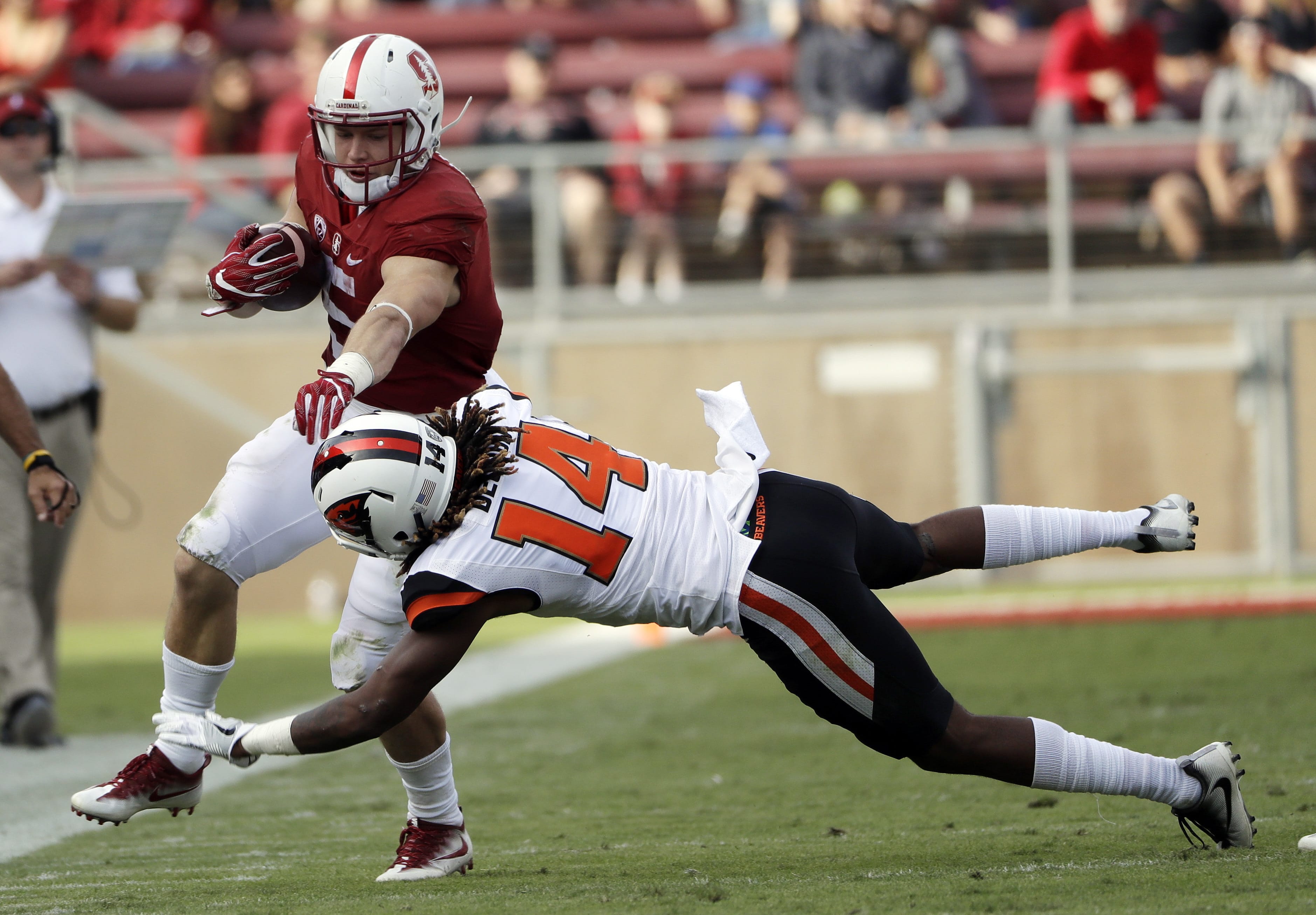 Stanford running back Christian McCaffrey (5) is tackled by Oregon State cornerback Treston Decoud (14) during the second half Saturday.