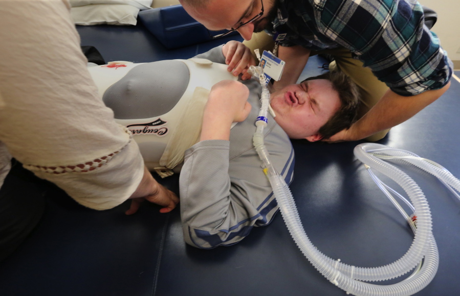 Hayden Werdal, 15, has physical therapy sessions in Silverdale, Wash., on Nov. 3, 2016.   As medical experts puzzle over the mysterious, polio-like illness that has afflicted eight Washington children this fall, Hayden, paralyzed by the same syndrome two years ago struggles to recover.