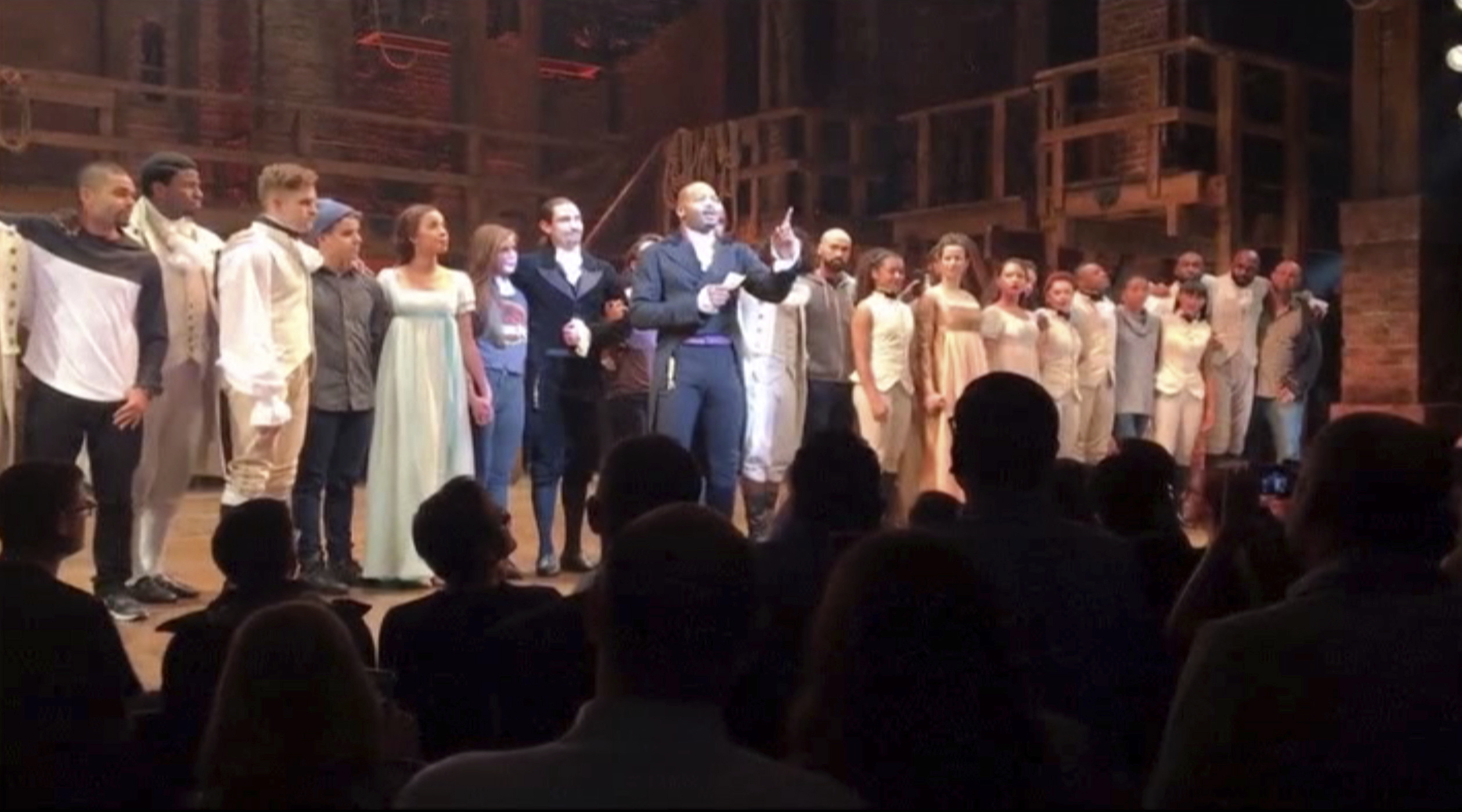 In this image made from a video provided by Hamilton LLC, actor Brandon Victor Dixon who plays Arron Burr, the nationÄôs third vice president, in "Hamilton" speaks from the stage after the curtain call in New York, Friday, Nov. 18, 2016. Vice President-elect Mike Pence is the latest celebrity to attend the Broadway hit "Hamilton," but the first to get a sharp message from a cast member from the stage.
