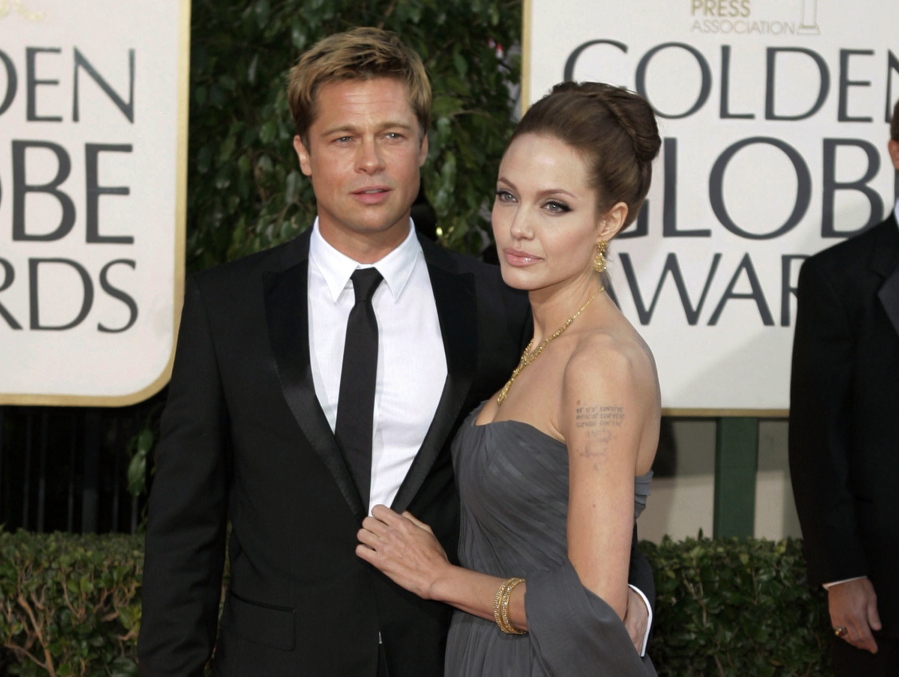 Actor Brad Pitt and actress Angelina Jolie arrive Jan. 15, 2007, for the 64th Annual Golden Globe Awards in Beverly Hills, Calif. Angelina Jolie Pitt and estranged husband Brad Pitt have reached a custody agreement regarding their six children, according to a statement released by a representative of the actress Monday. (AP Photo/Mark J.