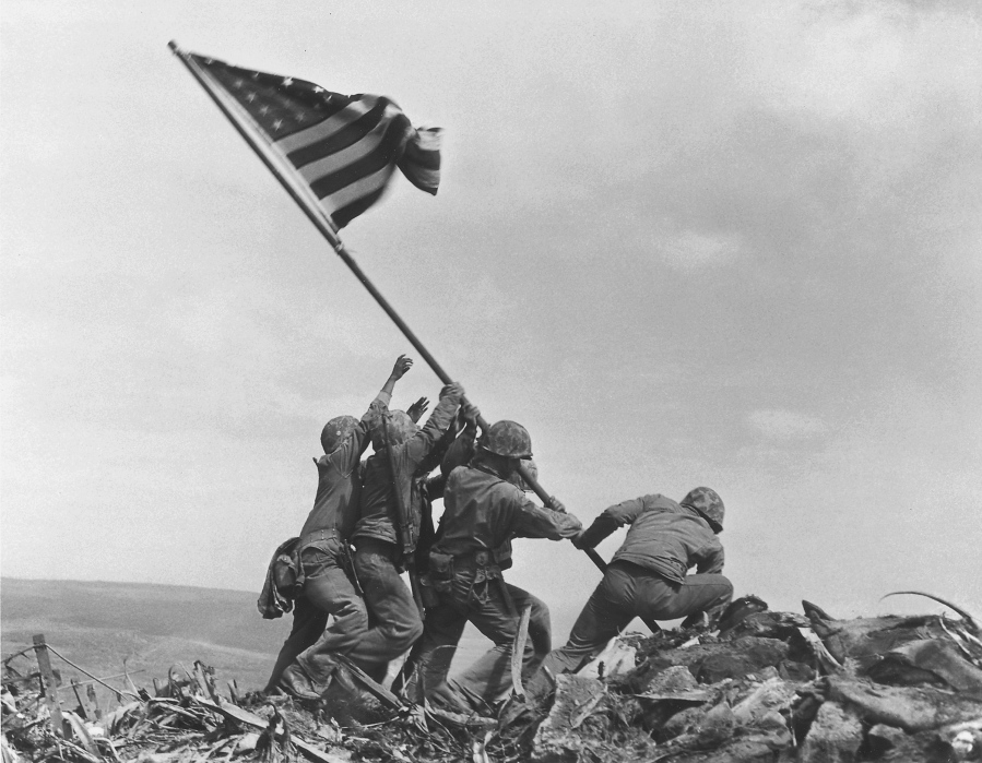 U.S. Marines raise the American flag atop Mount Suribachi on Iwo Jima, Japan, on Feb. 23, 1945. This iconic image is included in Time magazine&#039;s most influential images of all time, released Thursday.