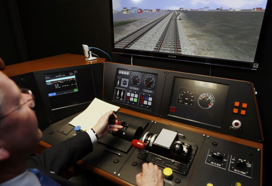 Metrolink Director of Operations, R.T. McCarthy, demonstrates Metrolink&#039;s implementation of positive-train control in 2014 at the Metrolink Locomotive and Cab Car Simulators training facility in Los Angeles&#039; Union Station.