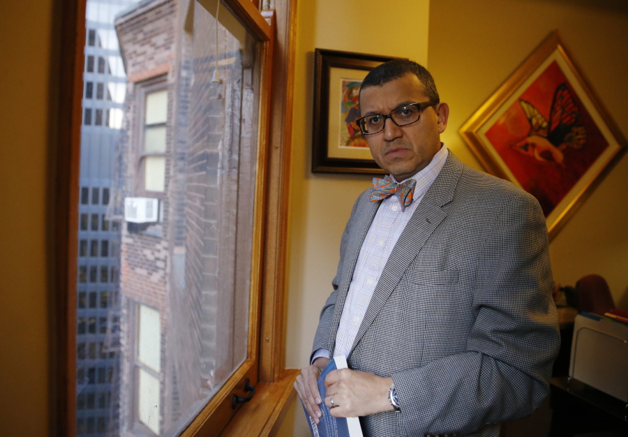 Moises Hernandez looks outside from his office on Thursday in Chicago. Moises Hernandez, a longtime Chicago immigration attorney, said he&#039;s seen an uptick in inquiries from clients since the election. He said many of the questions are from young people living in the country illegally who were granted work permits under a federal program started by President Barack Obama&#039;s administration. He said he&#039;s also heard from those with green cards who want to become U.S. citizens. (AP Photo/Nam Y.