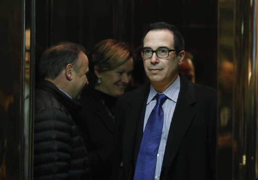 Steven Mnuchin, national finance chairman of President-elect Donald Trump&#039;s campaign, boards an elevator Monday as he arrives at Trump Tower in New York to meet with the president-elect.