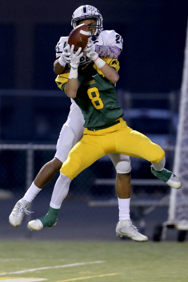 Richland&#039;s Alex Chapman (8) intercepts a pass intended for Skyview&#039;s Jeremiah Wright (21) Saturday.