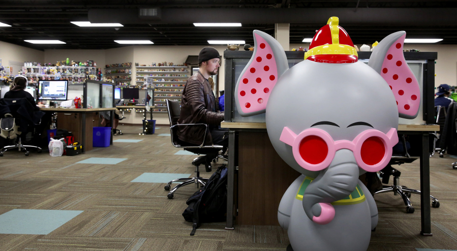 Bryce Pollett, an output assistant at Funko, works on a character at his computer at the Everett-based company.