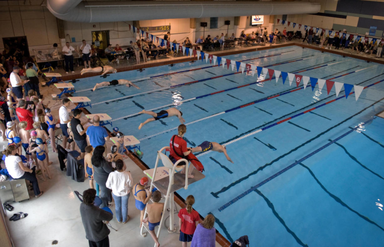 Racers begin a heat of the Vancouver Super Bowl X Invitational swim meet at the Marshall Community Center pool in January 2009.