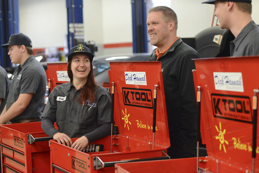 Evelyn Nagornyy, a first-year student in Clark College&#039;s automotive technology program, left, talks to Tom Gilstrap, center, a service manager at Dick Hannah Subaru, during a small ceremony at Clark College where automotive technology students received toolboxes from the Dick Hannah Dealerships in Vancouver.