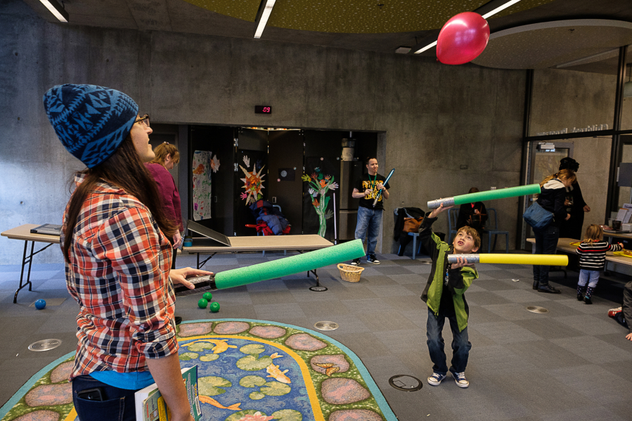 Kim Harless and her son, Aidyn Culp, 7, of Vancouver play with foam lightsabers Sunday afternoon during a Jedi training at the Vancouver Community Library. Children and their parents could participate in several &quot;Star Wars&quot;-themed activities during the Jedi-inspired event.