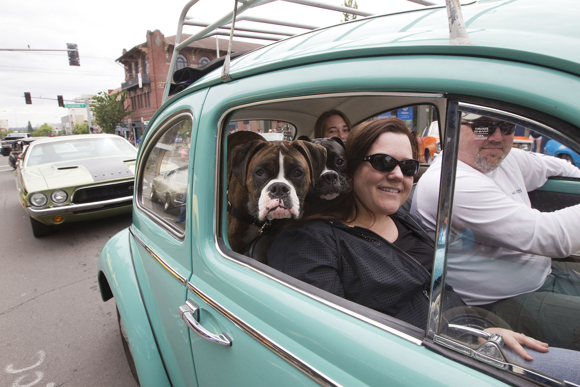 Susan Schrantz takes part in "Cruisin' the Gut" with her family in a VW Bug on Main Street in downtown Vancouver in 2016.