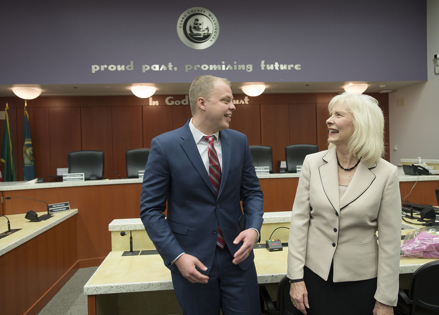 Incoming Clark County council members John Blom, left, and Eileen Quiring share a laugh following their swearing-in ceremony at the Clark County Public Service Center on Thursday morning.