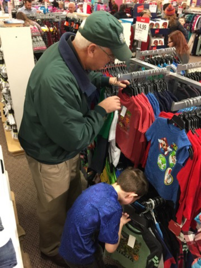 Vancouver Mall: Rotary member Wayne Clemetson helps a child shop at J.C.