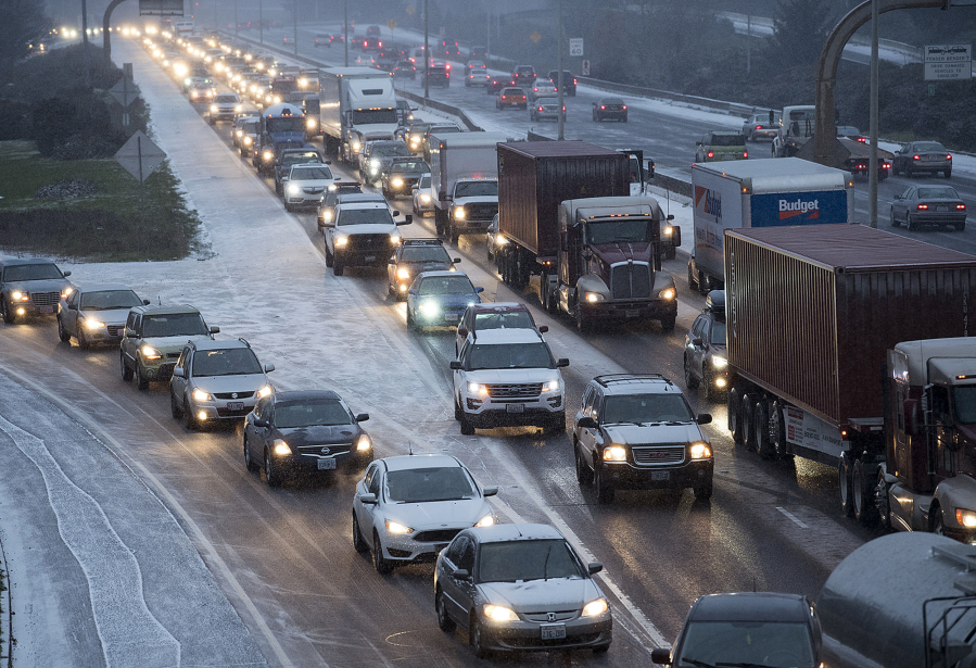 Drivers traveling on Interstate 5 navigate winter conditions as they make their way toward Portland on Wednesday afternoon.