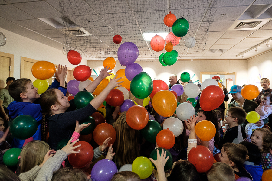 Balloons drop on children who had counted down to noon Saturday at the Noon Year&#039;s Celebration at the Three Creeks Community Library in Salmon Creek.