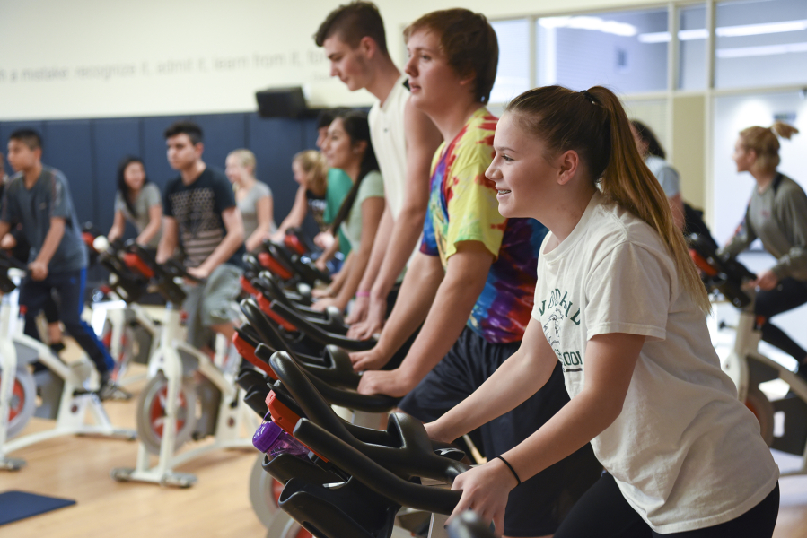 Woodland High School sophomore Ashley Yoder participates in one of three spin classes offered at the school. School officials have wanted to bring the physical education class to Woodland for years and were able to when the new high school opened in 2015.