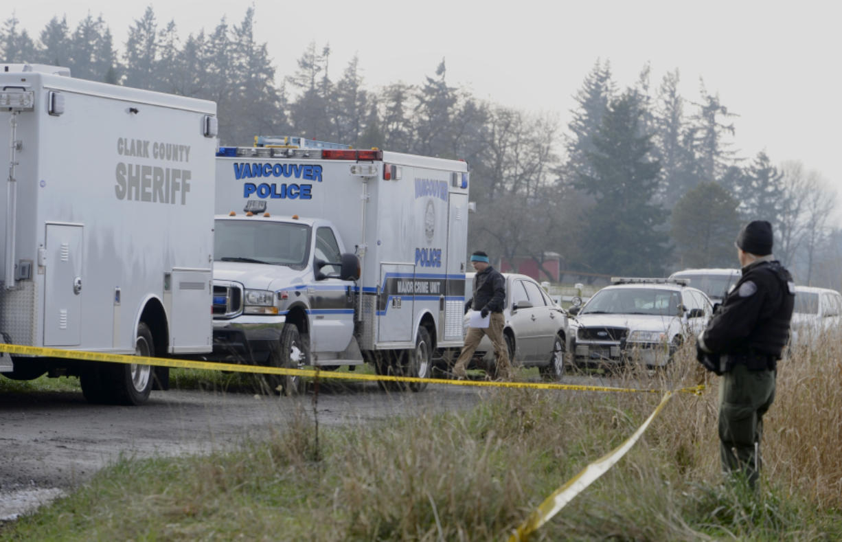 Police vehicles and crime tape surround the scene of an officer-involved homicide Sunday near a rural home east of Ridgefield. The deputy who shot and killed a suspected prowler on the property Sunday morning has been placed on leave during the shooting investigation, according to the Clark County Sheriff&#039;s Office.