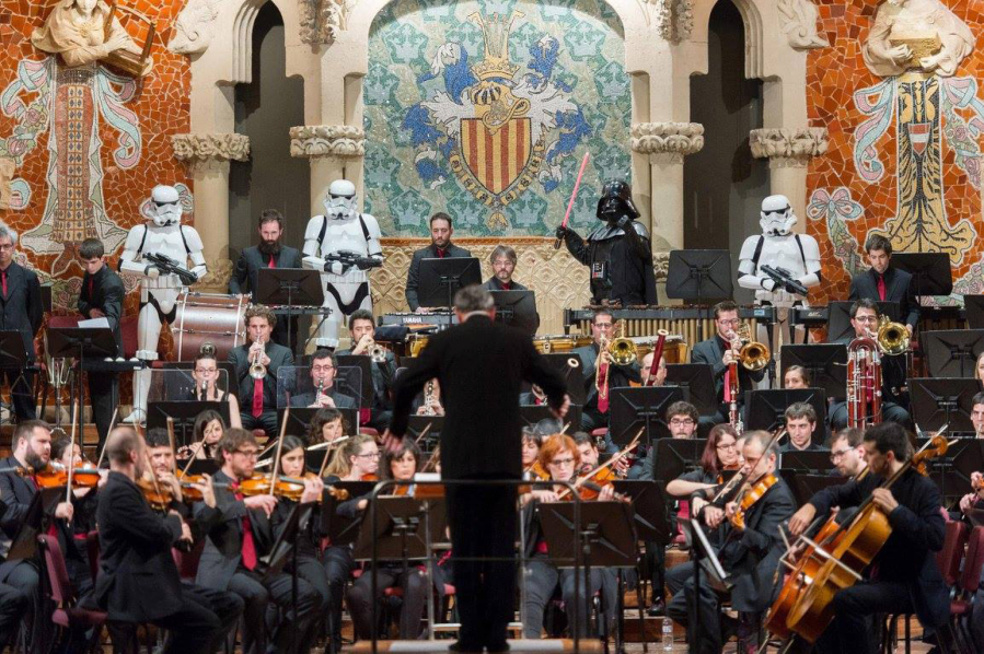 Salvador Brotons conducts the music of &quot;Star Wars&quot; at Barcelona&#039;s spectacular Palau de la Musica Catalana in December 2015 -- while Darth Vader and his minions keep the musicians in line.