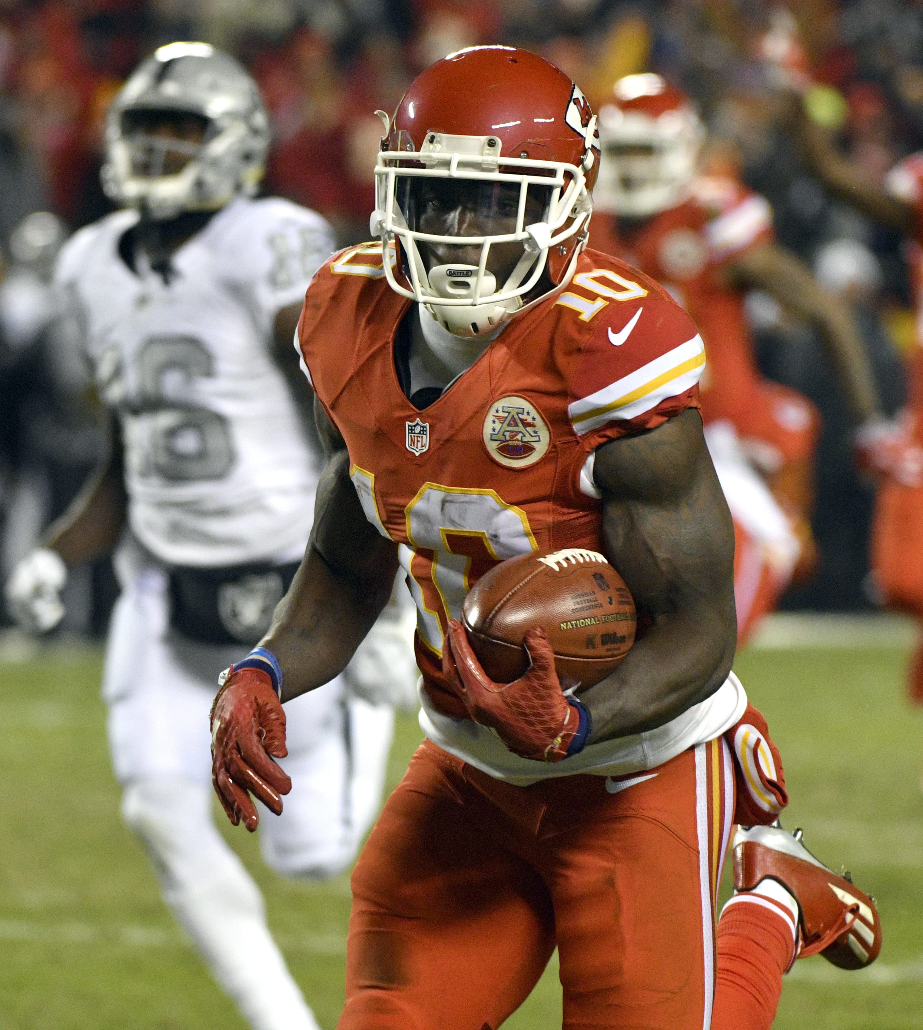 Kansas City Chiefs wide receiver Tyreek Hill (10) runs for a touchdown on a 78-yard kickoff return during the first half of an NFL football game against the Oakland Raiders in Kansas City, Mo., Thursday, Dec. 8, 2016.