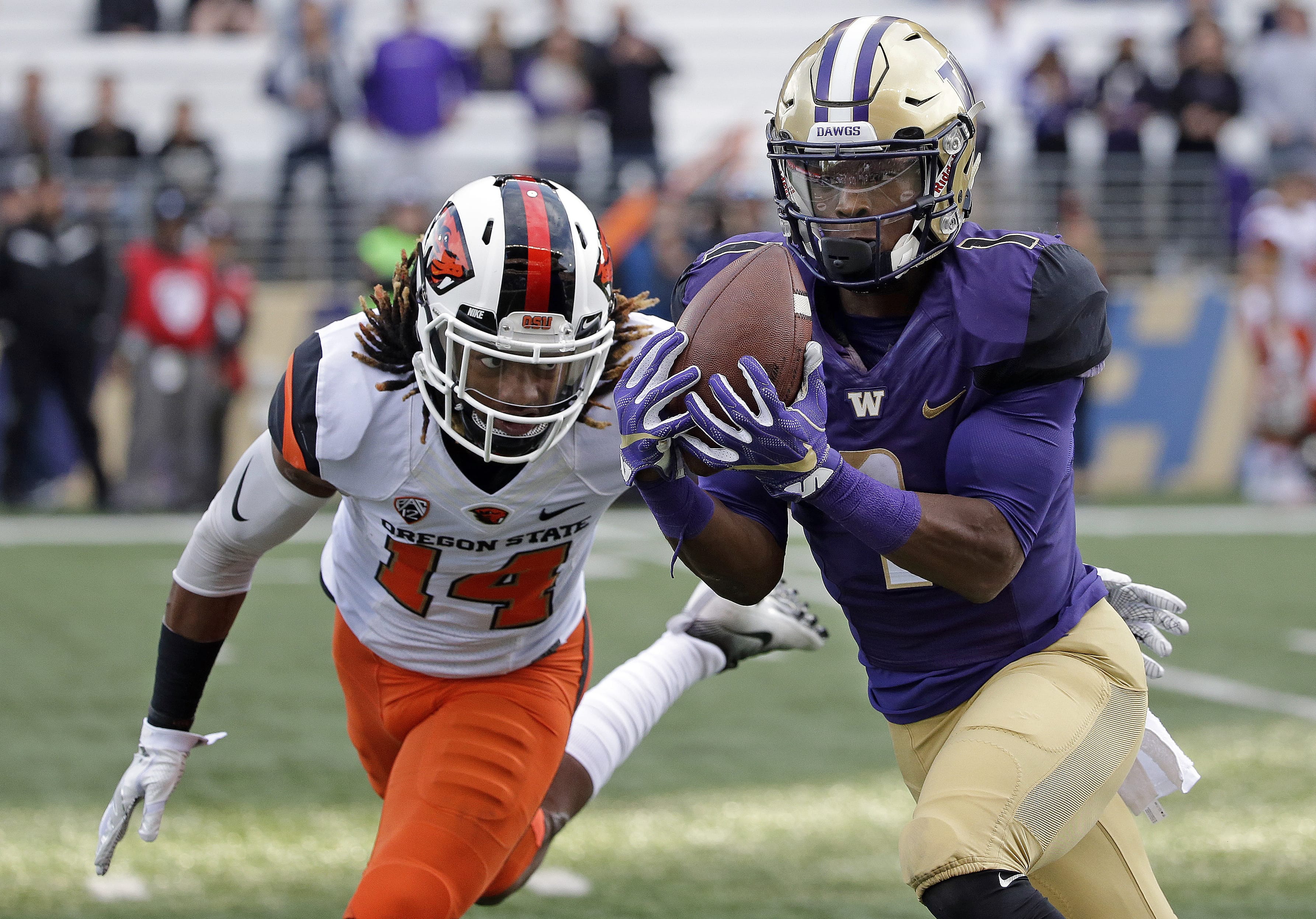 Washington's John Ross, right, is the player of the year on the Associated Press All-Pac-12 team announced on Friday, Dec. 9, 2016.