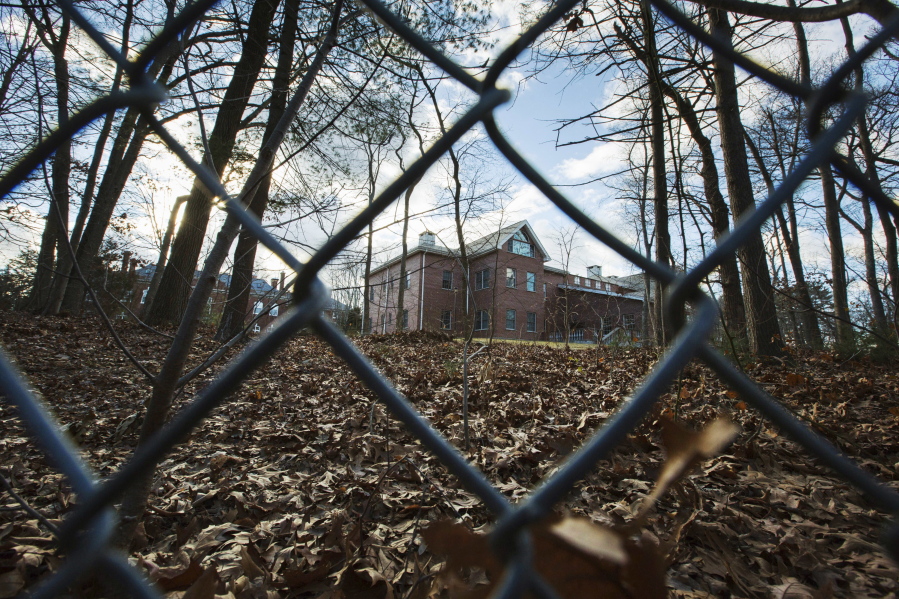 A fence encloses an estate in the village of Upper Brookville in the town of Oyster Bay, N.Y., on Long Island. The Obama administration has closed this compound for Russian diplomats in retaliation for cyberattacks. (ALEXANDER F.