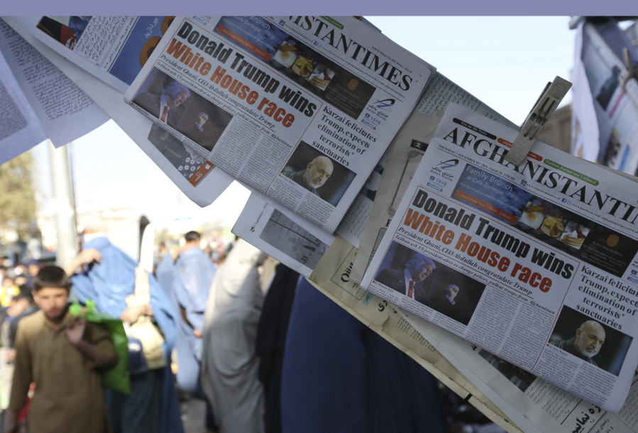 Newspaper front pages displayed for sale Nov. 10 outside a store reporting on President-elect Donald Trump winning the American election, in Kabul, Afghanistan. Afghanistan has fallen so far from the American consciousness that some may have forgotten it is called the forgotten war. Now in its 16th year and soon to be a responsibility of Donald Trump, two presidents removed from the October 2001 invasion, the conflict shows little sign of ending soon.
