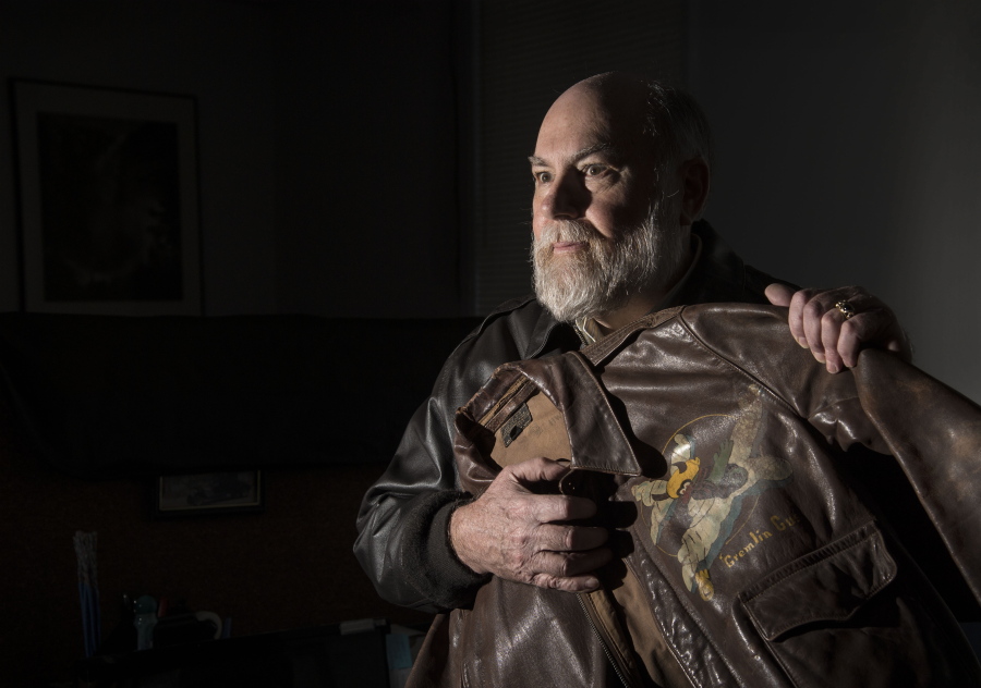 Greg Staples holds his father&#039;s vintage flight jacket in his office in north Spokane. Major Donald Staples died in a B-52 crash on Sept. 8, 1958, near Fairchild Air Force Base.