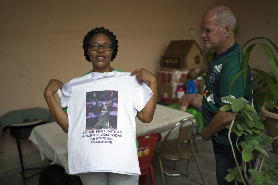 Valeria Zampier shows a T-shirt with a photo of her son, Brazil&#039;s Chapecoense soccer player Neto, on Thursday at her home in Rio de Janeiro, Brazil.
