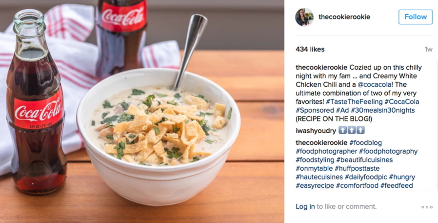 A social media post featuring a bottle of Coca-Cola next to a bowl of chicken chili.