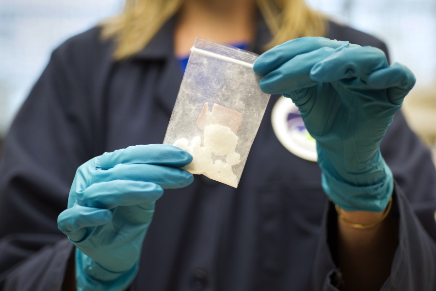 A bag of 4-fluoroisobutyrylfentanyl, which was seized in a drug raid, is displayed at the Drug Enforcement Administration Special Testing and Research Laboratory in Sterling, Va. A novel class of deadly drugs is exploding across the country, with many manufactured in China for export around the world. The drugs, synthetic opioids, are fueling the deadliest addiction crisis the U.S. has ever seen.