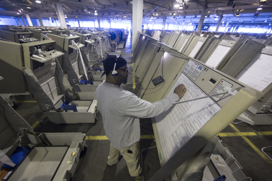 A technician works to prepare voting machines to be used in the upcoming election in Philadelphia. These paperless digital voting machines, used by roughly one in five U.S. voters last month, present one of the most glaring dangers to the security of the rickety, underfunded U.S. election system. Like many electronic voting machines, they are vulnerable to hacking. But other machines typically leave a paper trail that could be manually checked.