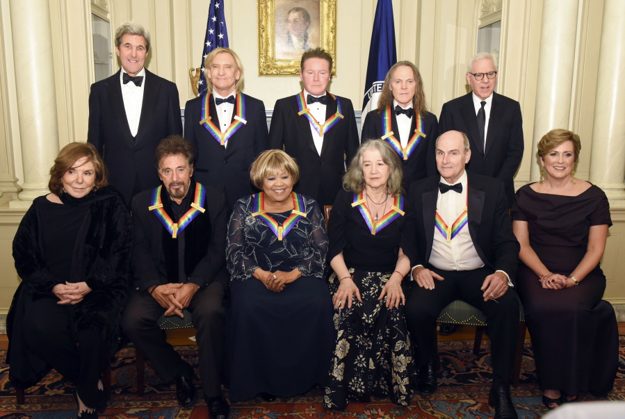 Teresa Heinz Kerry, front row, from left, Kennedy Center Honorees Al Pacino, Mavis Staples, Martha Argerich, James Taylor, and Kennedy Center President Deborah Rutter; rear row, from left, Secretary of State John Kerry, Kennedy Center Honorees Joe Walsh, Don Henley, and Timothy Schmit, and David Rubinstein are photographed following the State Department for the Kennedy Center Honors gala dinner Saturday in Washington.