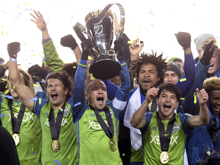 Members of the Seattle Sounders celebrate after winning the MLS Cup soccer final over Toronto FC in Toronto, Saturday, Dec. 10, 2016.