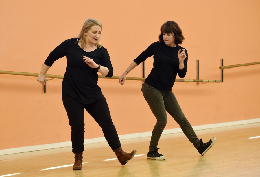 Mandy Moore, left, choreographer for &quot;La La Land,&quot; teaches dance moves from the film to reporter Sandy Cohen at Screenland Studios in Los Angeles.