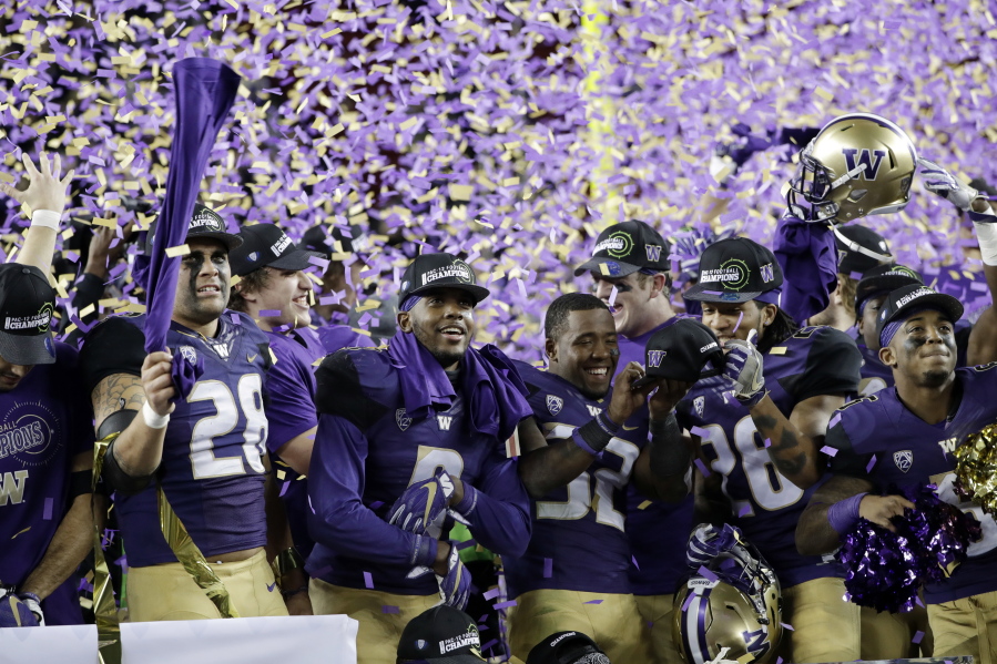 Washington players celebrate the team&#039;s 41-10 win over Colorado in the Pac-12 Conference championship NCAA college football game Friday, Dec. 2, 2016, in Santa Clara, Calif.