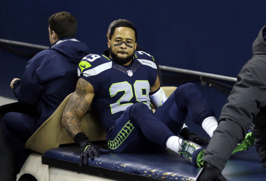 Seattle Seahawks&#039; Earl Thomas leaves the field on a cart after being injured against the Carolina Panthers in the first half of an NFL football game, Sunday, Dec. 4, 2016, in Seattle.