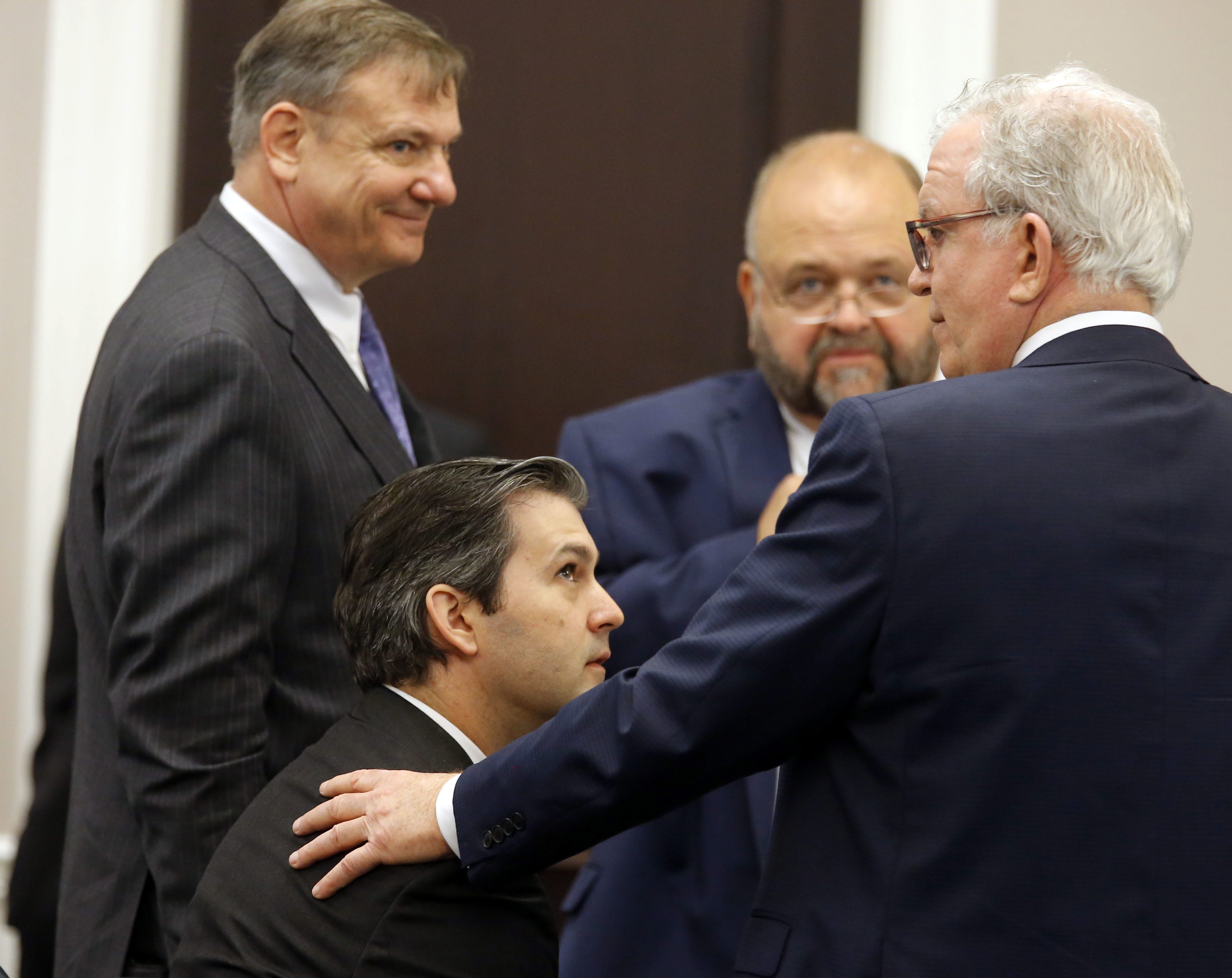 Defense attorneys Don McCune, left, Andy Savage and Miller Shealy surround former North Charleston police officer Michael Slager after a note was sent by the jury as they continue to deliberate at the Charleston County court in Charleston, S.C., Monday, Dec. 5, 2016. The jury remained undecided, but not deadlocked, on Monday in the murder trial of Slager who is charged with shooting a black motorist in South Carolina last year.