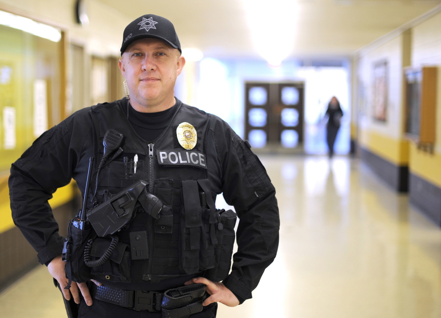 Police officer Jason Griggs poses in late November at a school in North Bend, Ore. The North Bend Police Department has adopted a new program to help juvenile offenders, one that also gives power back to the victims.  Griggs is a school resource officer and would have the most contact with young offenders in the &quot;Restorative Justice&quot; program where the offenders talk to their victims to understand the impact of their actions.