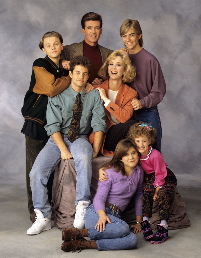 The cast of &quot;Growing Pains,&quot; standing from left, Leonardo DiCaprio, Alan Thicke and Jeremy Miller, with Kirk Cameron, seated center left, Joanna Kerns, seated center right, Tracey Gold, seated left on floor, and Ashley Johnson.