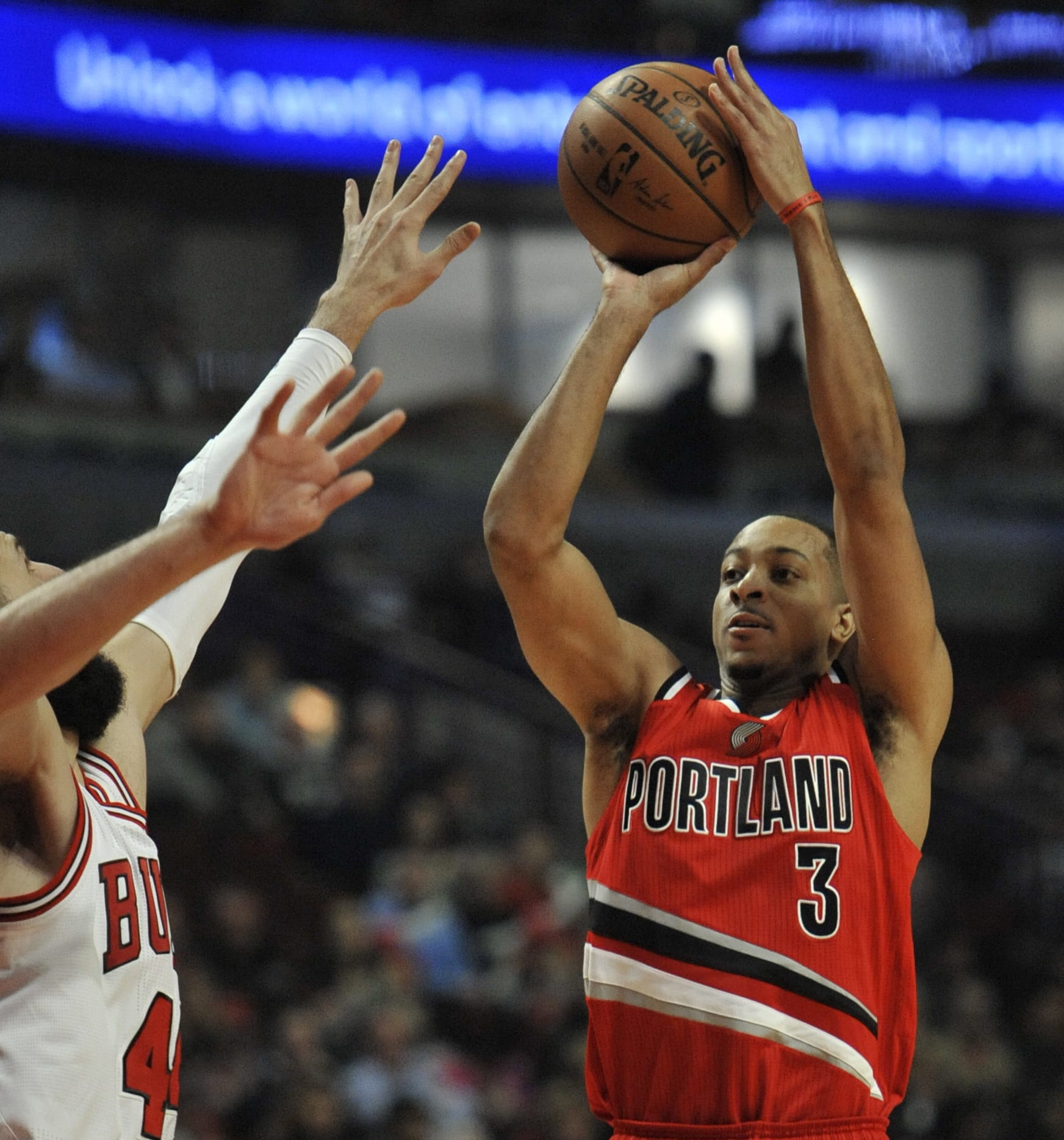 Portland Trail Blazers' CJ McCollum (3) goes up for a shot against Chicago Bulls' Nikola Mirotic (44) of Montenegro, during the first half of a NBA basketball game Monday, Dec. 5, 2016, in Chicago. Portland won 112-110.