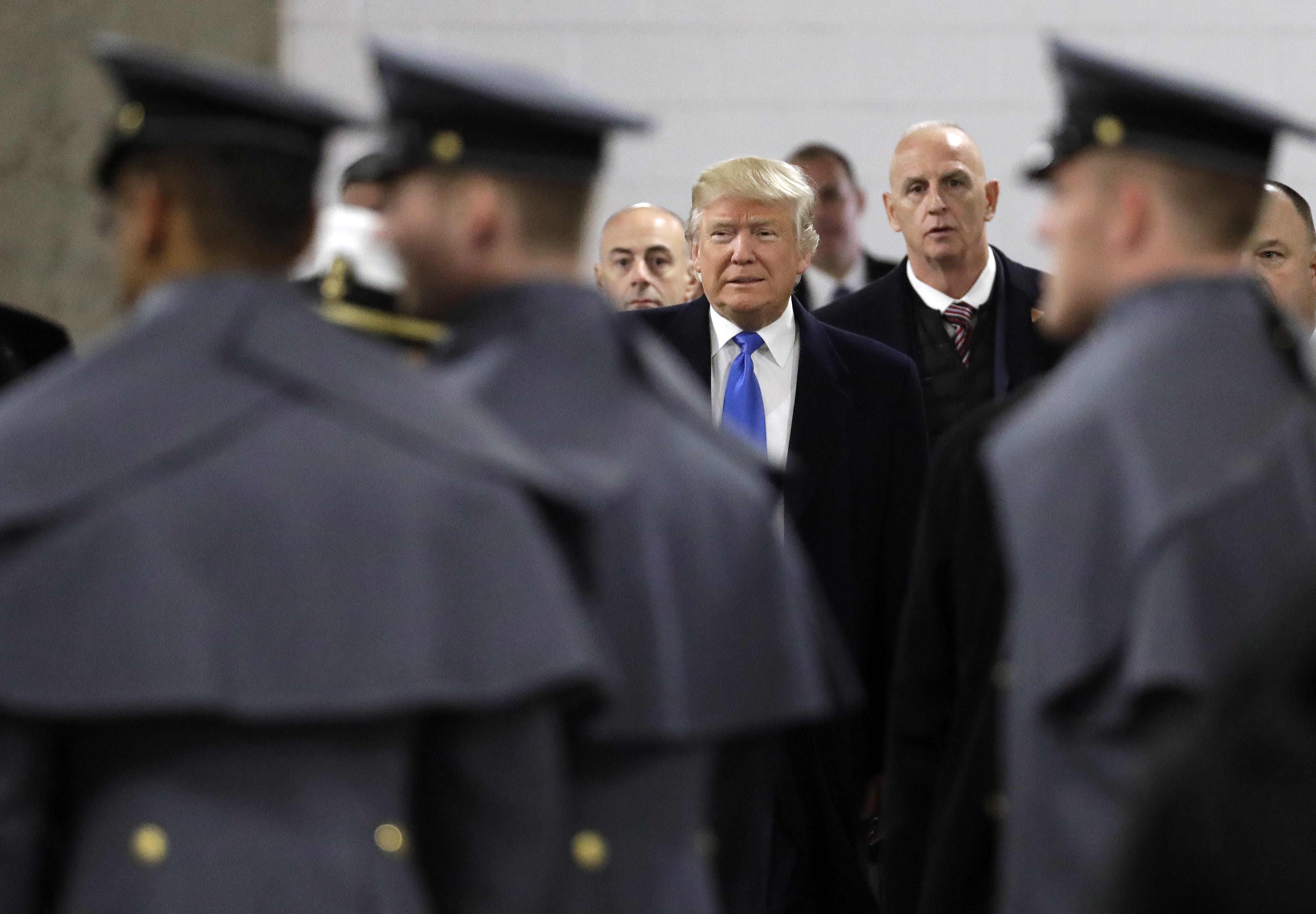 President-elect Donald Trump walks up to greet Army Cadets and Navy Midshipmen before the Army-Navy NCAA college football game in Baltimore, Saturday, Dec. 10, 2016.
