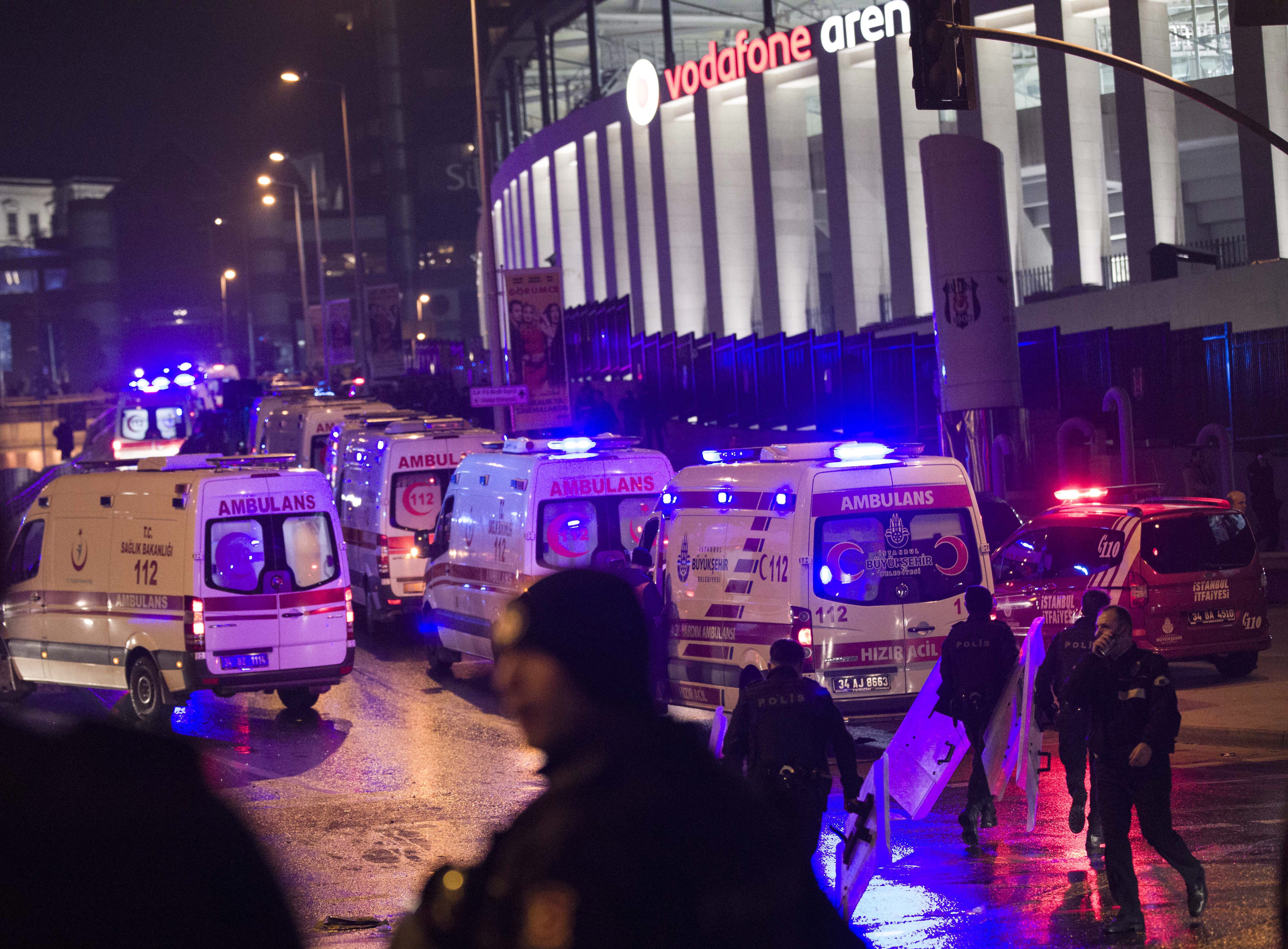 Police officers and ambulances fill the street next to the Besiktas football club stadium, in Istanbul, late Saturday, Dec. 10, 2016. Two loud explosions have been heard near the newly built soccer stadium and witnesses at the scene said gunfire could be heard in what appeared to have been an armed attack on police.Turkish authorities have banned distribution of images relating to the Istanbul explosions within Turkey.