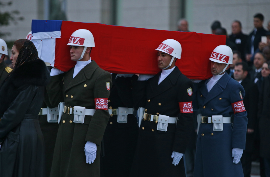 Members of a Turkish forces honour guard carry the Russian flag-draped coffin of Russian Ambassador to Turkey, Andrei Karlov, who was assassinated Monday, during a ceremony at the airport in Ankara, Turkey, on Tuesday. Turkey and Russia are more committed than ever to advance peace efforts in Syria, the two countries&#039; foreign ministers declared Tuesday, a day after the killing in an attack both countries described as an attempt to disrupt their improved ties.